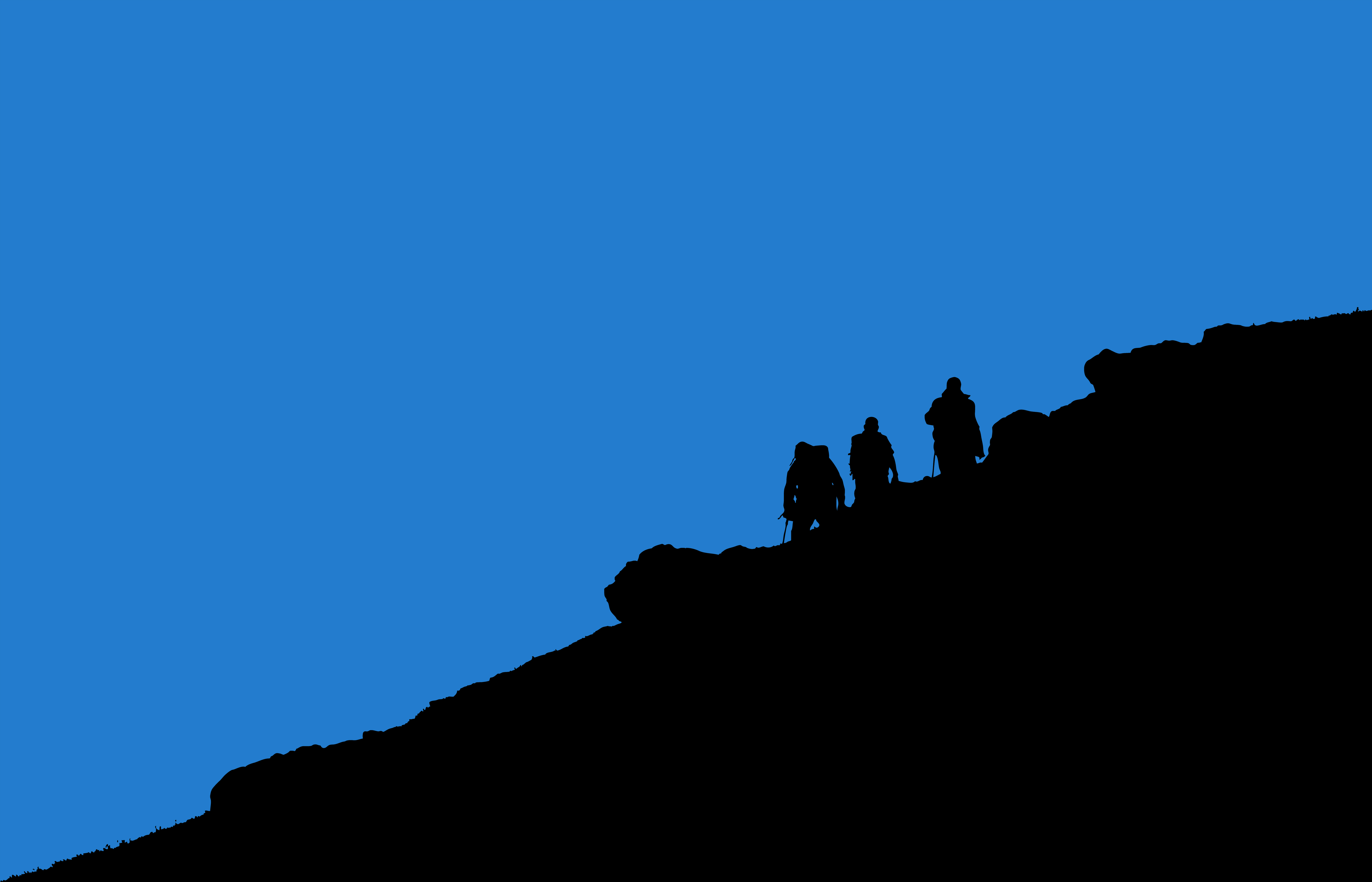 Photograph of the silhouette of 3 men hiking up a mountain.